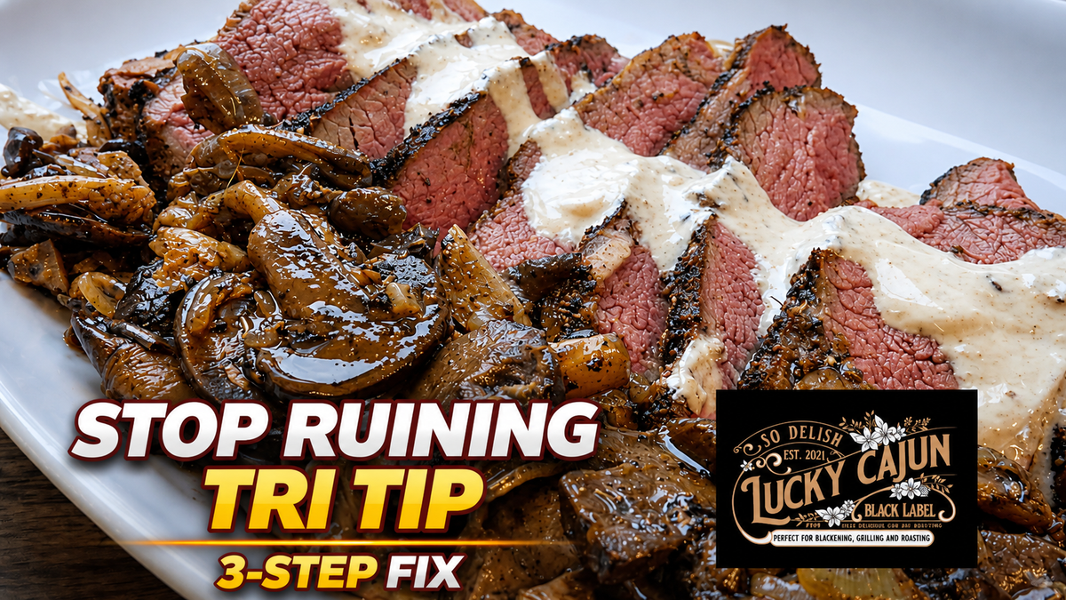 Sliced tri tip on a wooden board with creamy horseradish sauce and pan sauce mushrooms, cooked cast iron and oven method with Lucky Cajun Muy Thai seasoning.