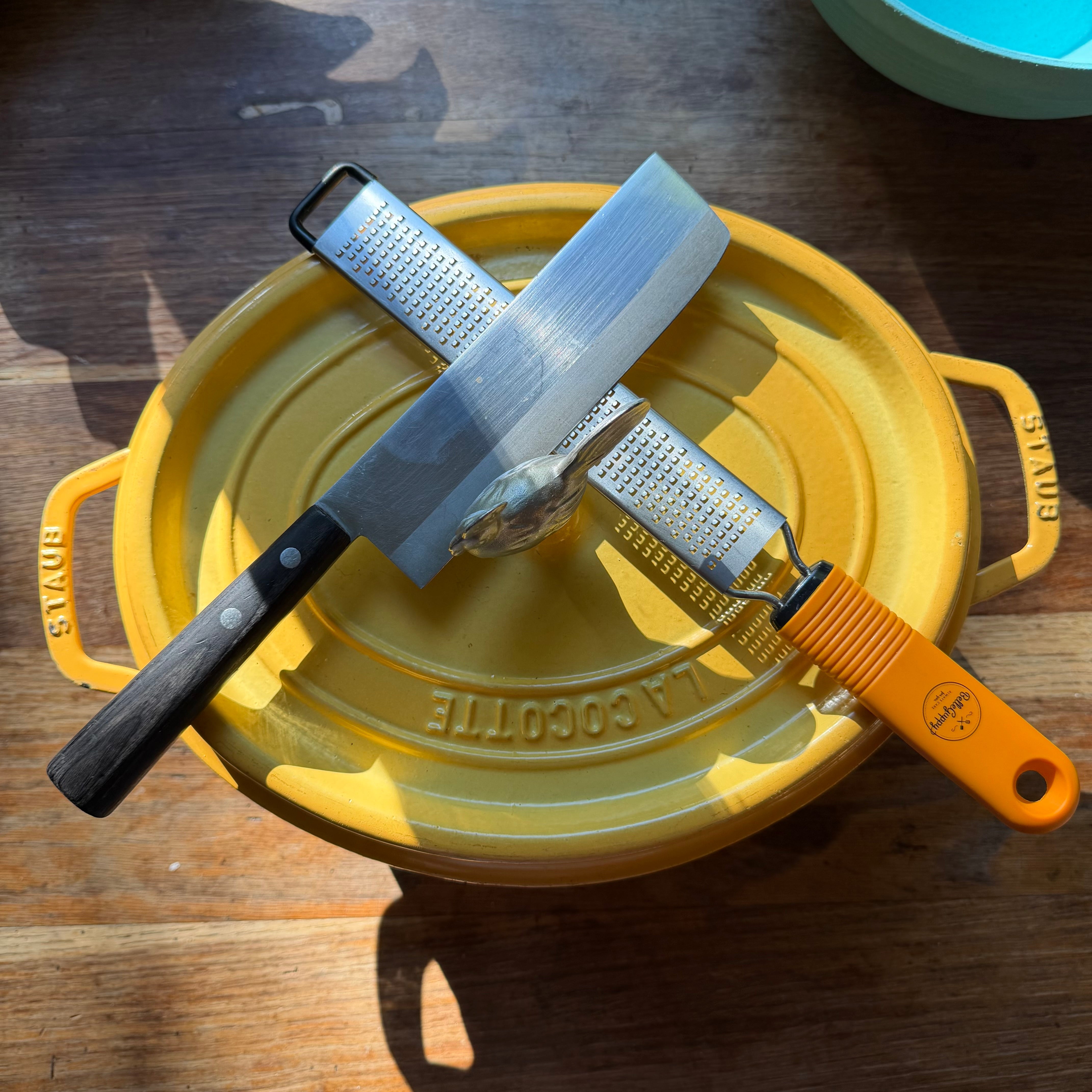 Kitchen tools used by Chef Blackwell Smith including cast iron skillet, chef knife, stainless steel pot, cutting board, and mixing bowls for everyday home cooking