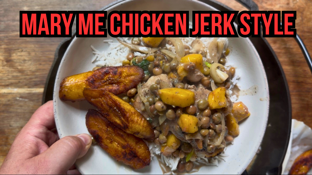 Close up of jerk chicken with coconut mango sauce served over white rice with roasted plantains held by Chef Blackwell Smith showing the creamy spicy finished dish made with Lucky Cajun What A Jerk seasoning