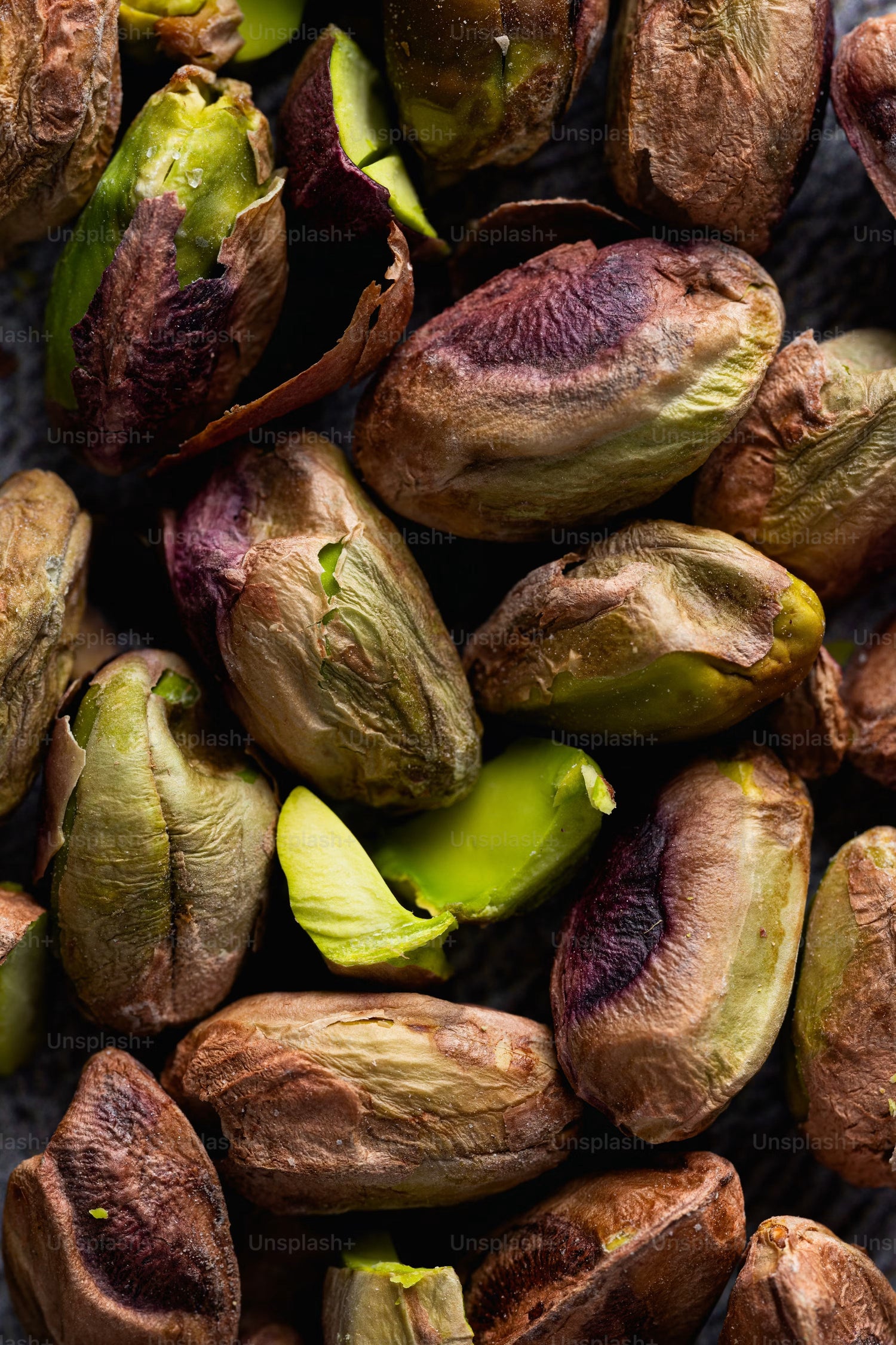 Close up of roasted pistachios showing the rich green color and texture of the key ingredient in pistachio vinaigrette for seafood
