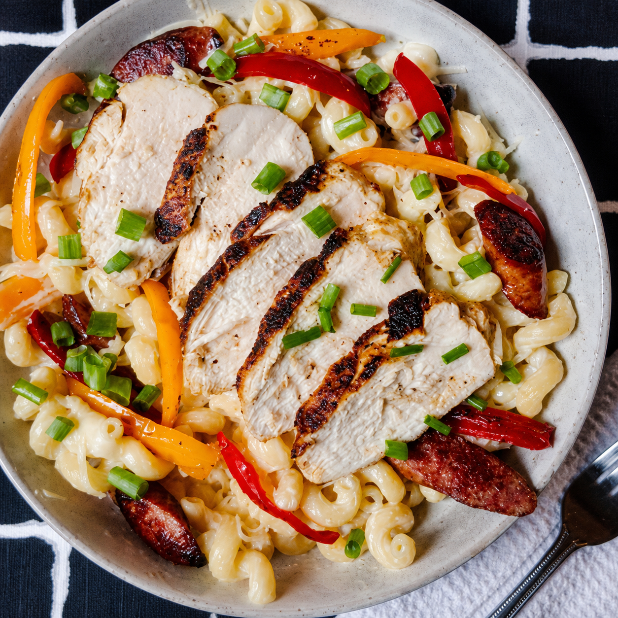 Creamy blackened chicken pasta with peppers, seasoned with Black Beard’s Smoke fresh-ground habanero and chipotle Cajun spice.