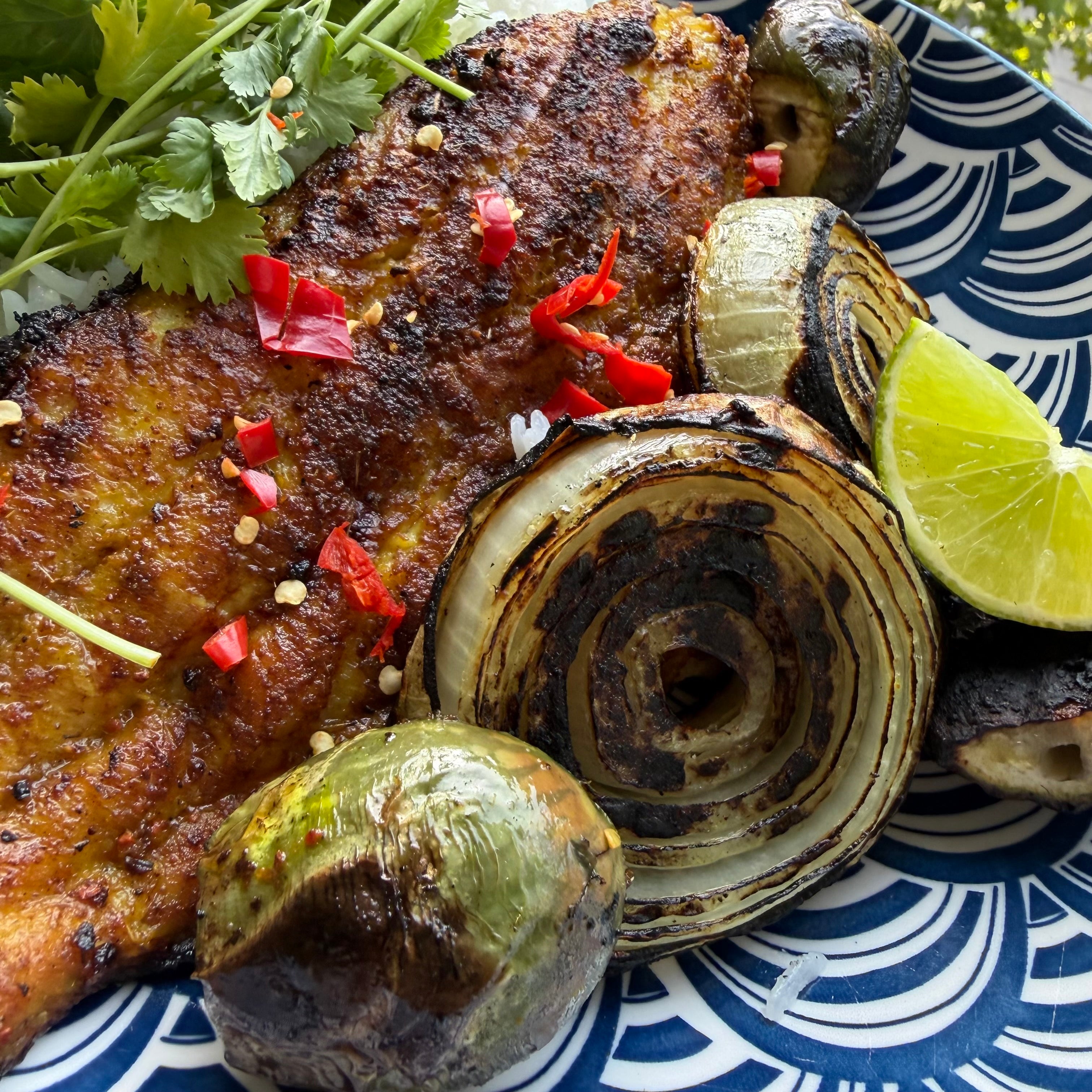 Plated dish close-up with charred onion and Muay Thai Thai seasoning — Lucky Cajun Handmade