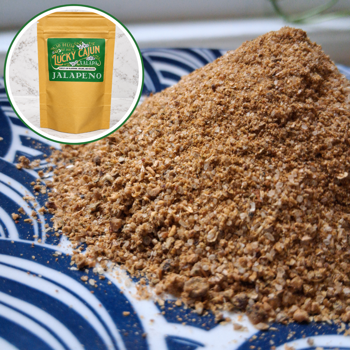 Fresh-ground green Cajun jalapeño seasoning piled on a plate, showing bright green chili and lime color