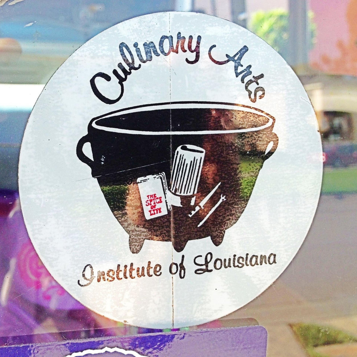 Culinary Arts Institute Of Louisiana logo in window