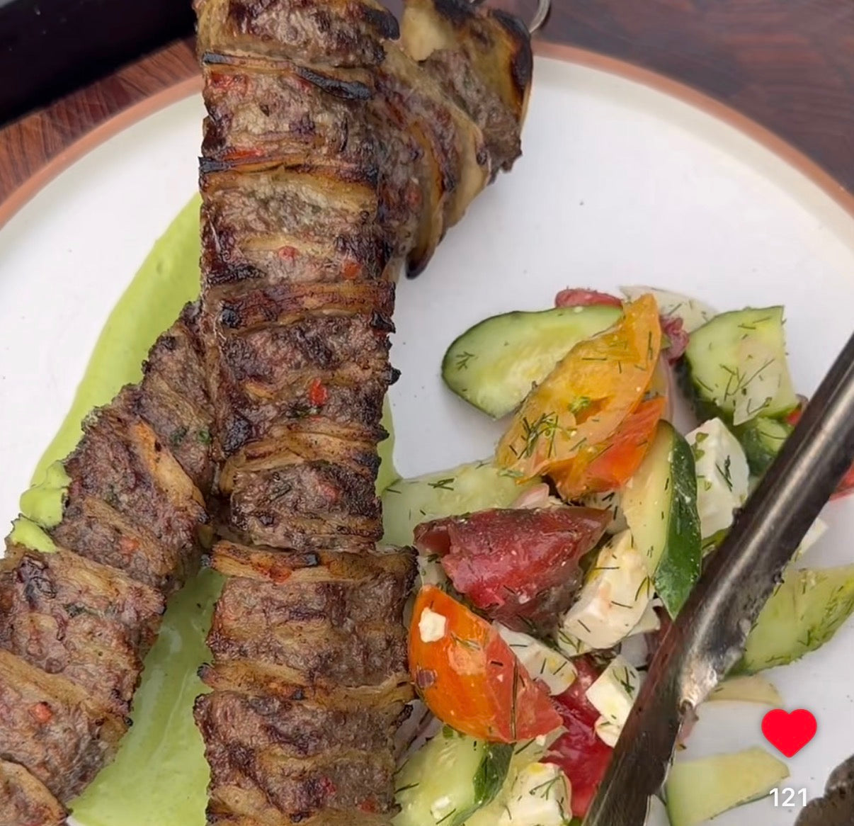 Greek tortilla kebabs made with wagyu and fresh ground Lucky Cajun Greek Out Seasoning grilled over charcoal served over herby yogurt dip with a Greek salad