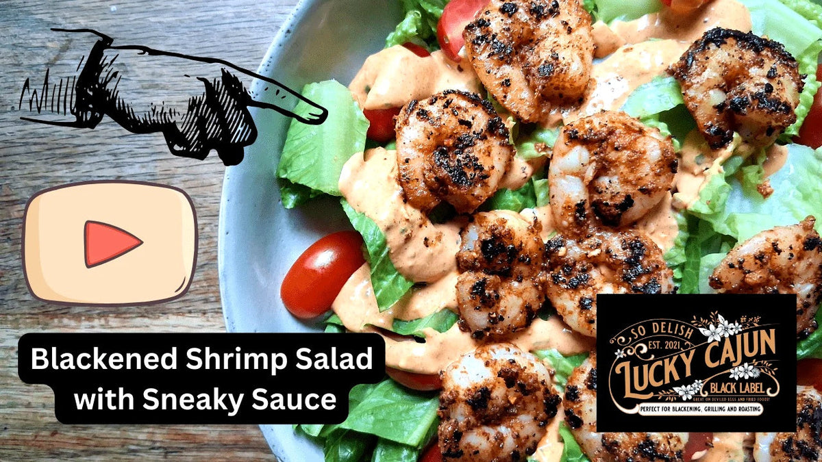 Blackened Shrimpasald with remoulade tomatos and reomaine on wooden table