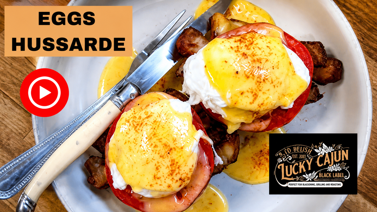Hew Orleans Brunch Classic Hussarde with tasso, tomato, english muffin poached eggs hollandaise and lucky Cajun seasoning