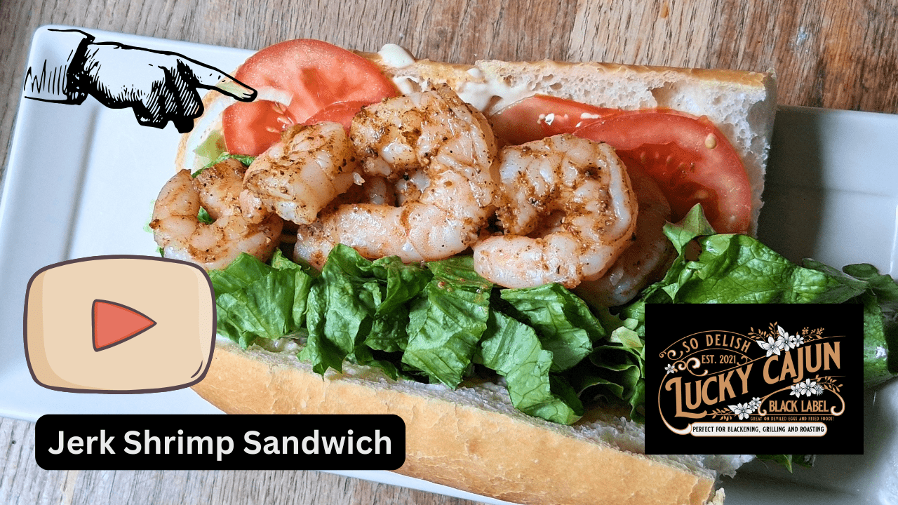 YouTube tutorial thumbnail of a jerk shrimp po'boy sandwich with garlic mayo lettuce tomato and red onion made with Lucky Cajun What A Jerk fresh ground seasoning showing how to season Cajun shrimp the right way