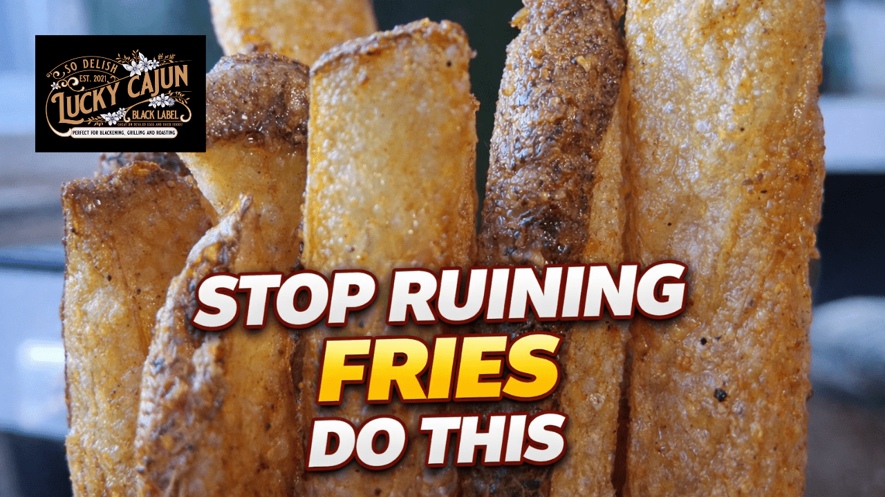 Close up of golden crispy double-fried french fries seasoned with Lucky Cajun fresh-ground seasoning with the Lucky Cajun logo