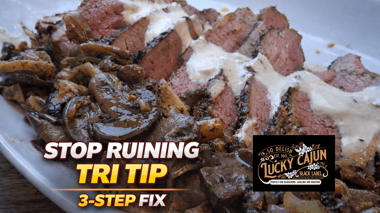 Sliced tri tip on a wooden board with creamy horseradish sauce and pan sauce mushrooms, cooked cast iron and oven method with Lucky Cajun Muy Thai seasoning.