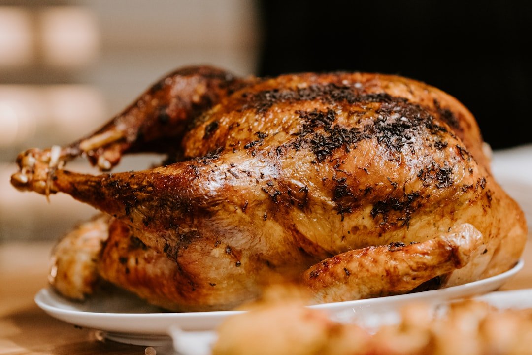 Perfectly roasted Thanksgiving turkey with golden crispy skin brined overnight with Lucky Cajun Bird Doctor Turkey Brine and rubbed with Salt-Free Original showing the deep color and juicy result of a properly brined and basted bird