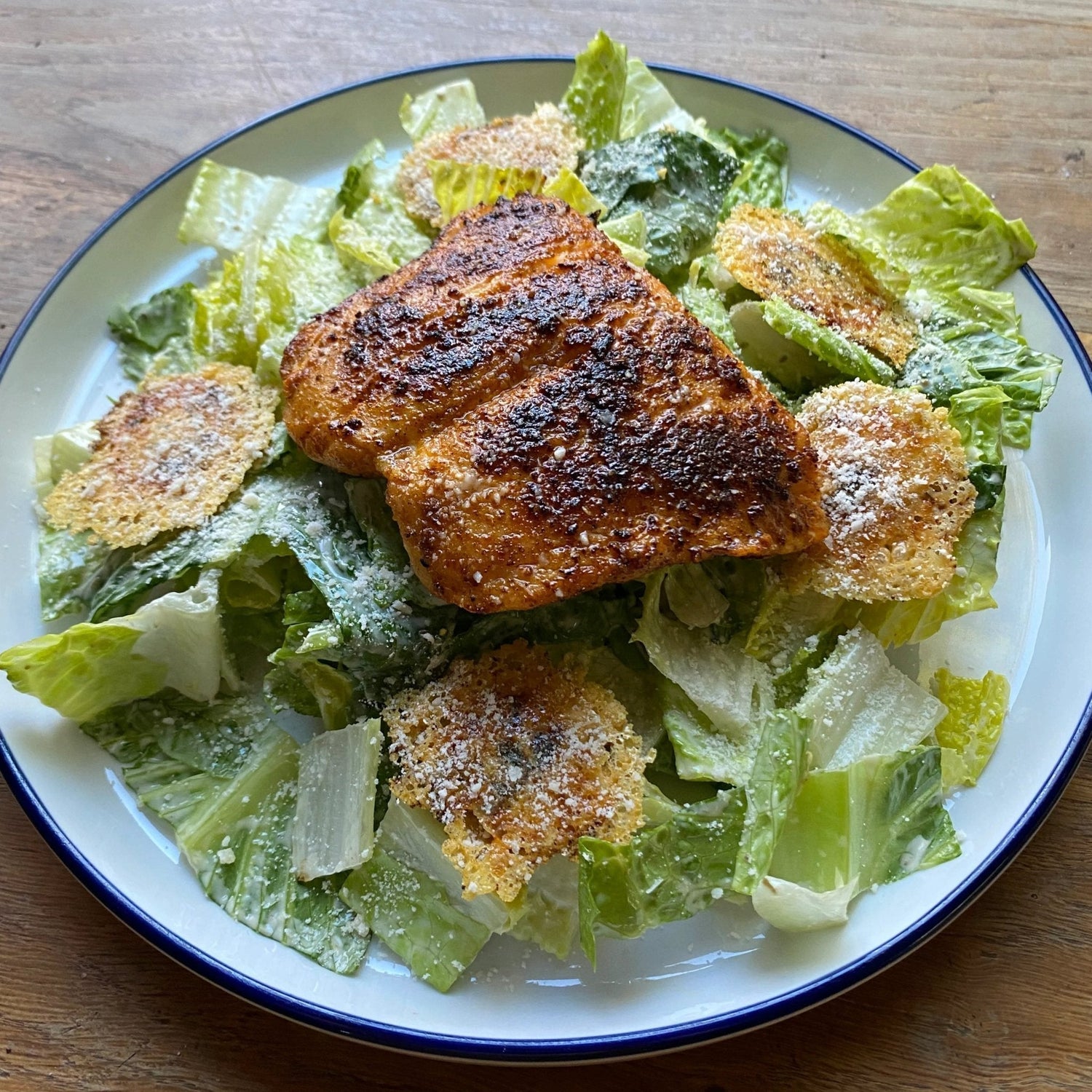 Blackened salmon Caesar salad showing the dark spiced crust from searing salmon in ripping-hot cast iron with Lucky Cajun Blackened Scorpion seasoning