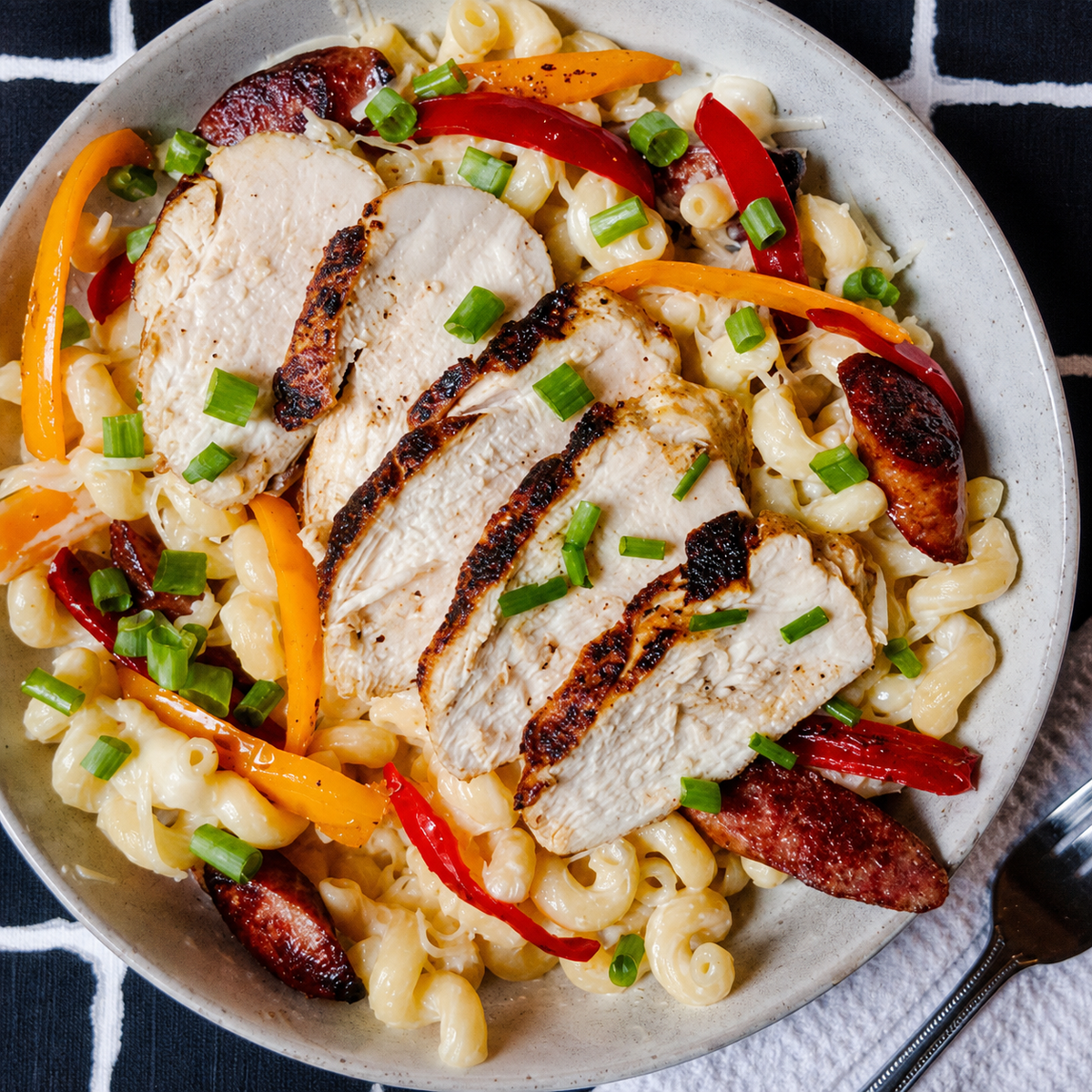 Creamy blackened chicken pasta with peppers, seasoned with Black Beard’s Smoke fresh-ground habanero and chipotle Cajun spice.