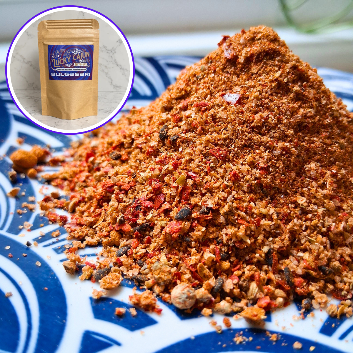 Fresh-ground Bulgasari Cajun Korean fusion seasoning piled on a plate, showing coarse texture and red chili color