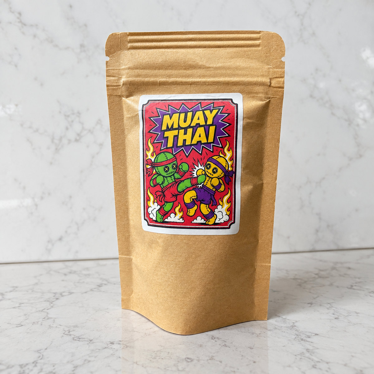 A brown kraft paper stand-up pouch with a colorful 'MUAY THAI' cartoon label on the front, standing on a light marble surface against a marble wall.