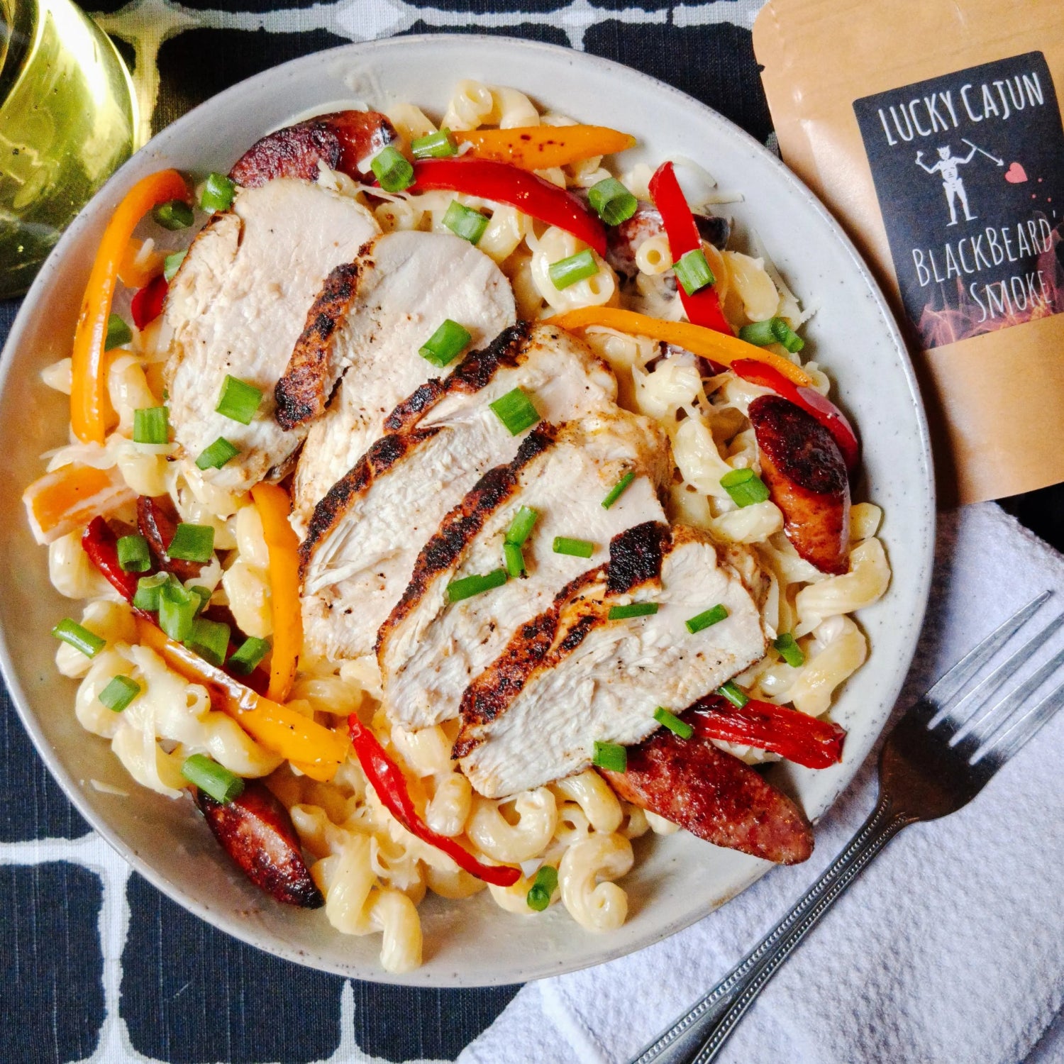 Creamy blackened chicken pasta with peppers, seasoned with Black Beard’s Smoke fresh-ground habanero and chipotle Cajun spice.