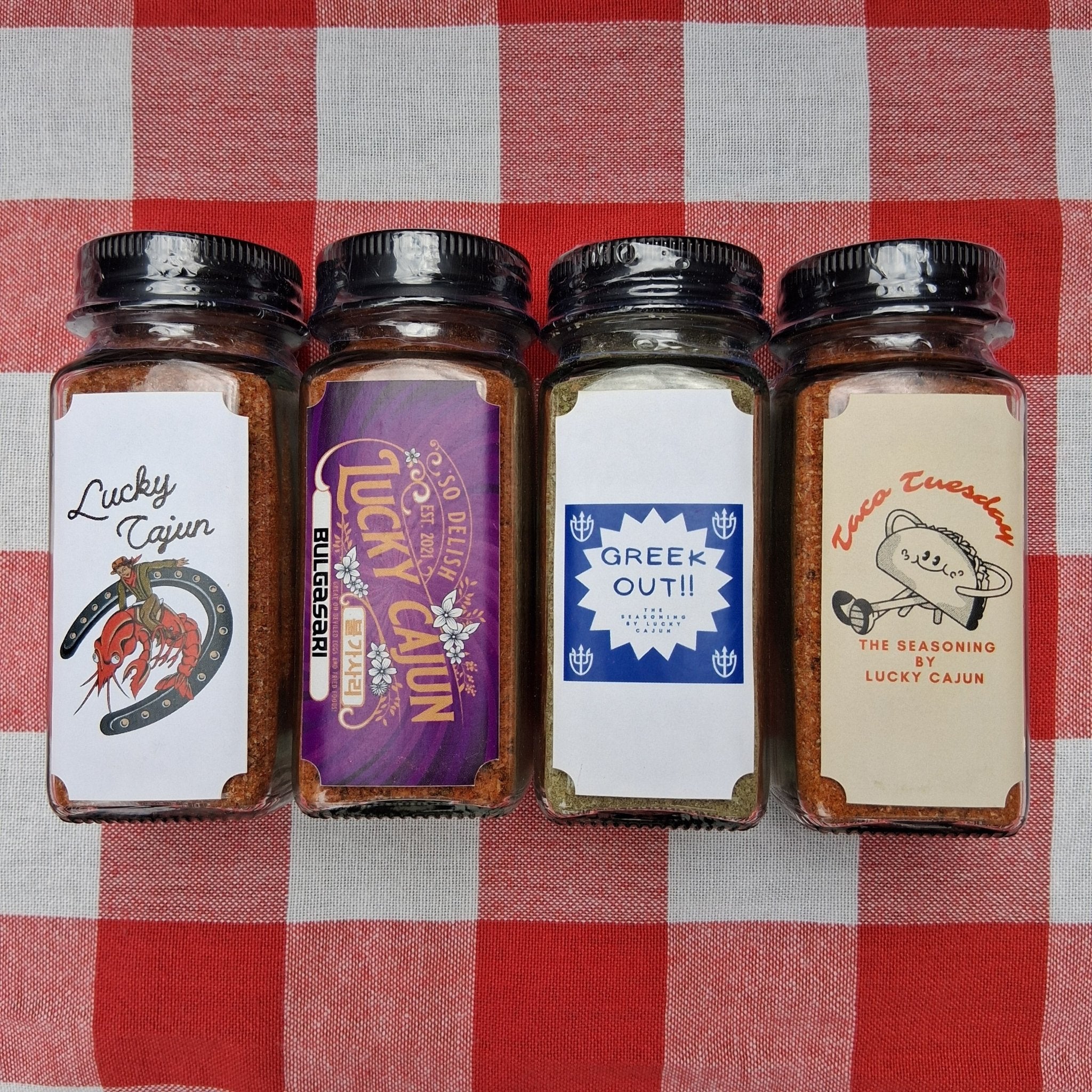 Premium glass jar 4-pack of fresh-ground Bulgasari and Cajun seasonings. A refillable, sugar-free gift option to replace stale warehouse dust.