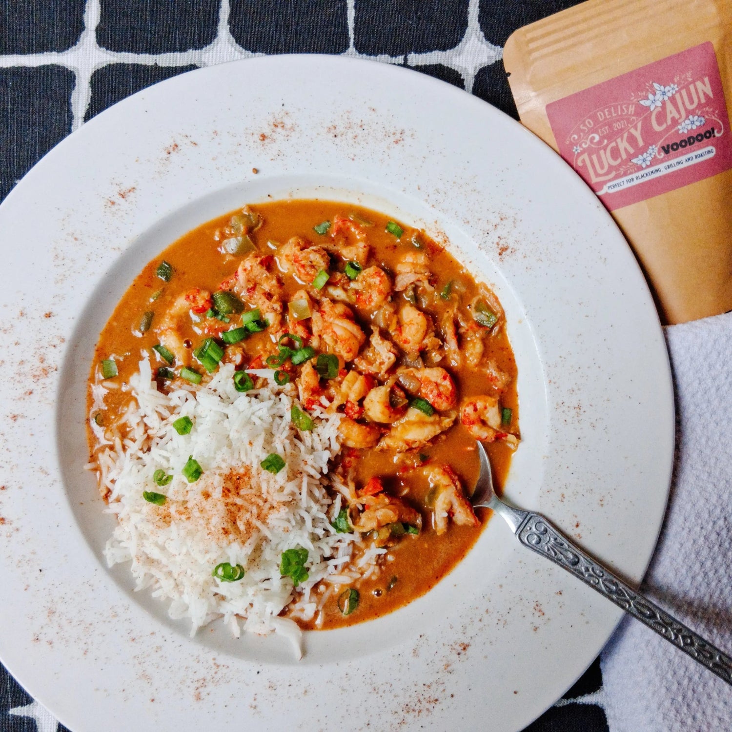 A bowl of crawfish étouffée over rice, seasoned with Voodoo Enhanced Cajun Blend for habanero heat and authentic depth.